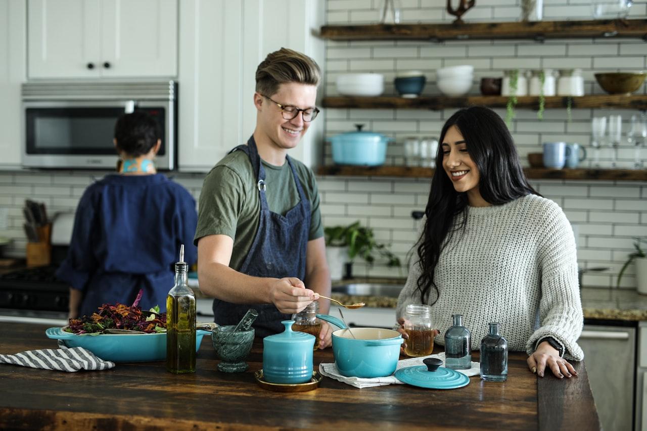 Couple cooking together in kitchen